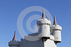 Funfair turrets against a blue sky photo