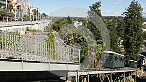 Funicular cars traveling on tracks in downtown Pau, France