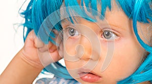 Funky beauty. Small child wear blue wig hair. Small kid in fancy wig hairstyle. Adorable little child in fashion wig