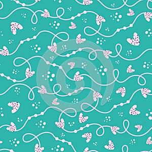 Funky bubbly pink and cream hand drawn doodle lines and hearts seamless vector pattern turquoise background.