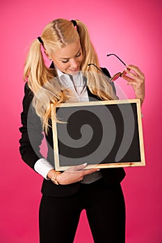 Funky business woman holding a blank blackboard - teacher