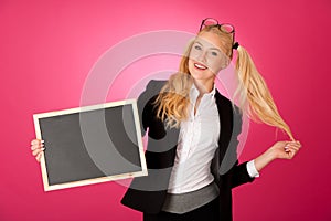 Funky business woman holding a blank blackboard - teacher