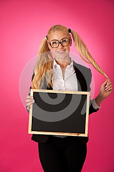 Funky business woman holding a blank blackboard - teacher