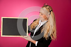 Funky business woman holding a blank blackboard - teacher
