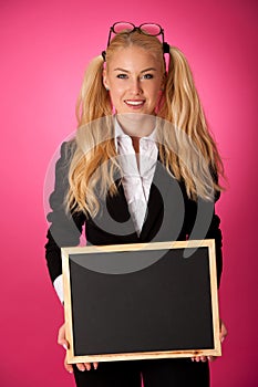 Funky business woman holding a blank blackboard - teacher