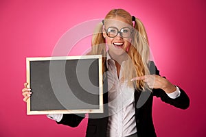 Funky business woman holding a blank blackboard - teacher