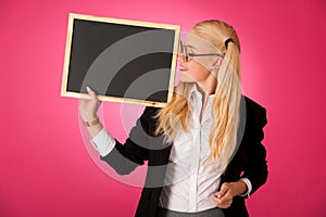 Funky business woman holding a blank blackboard - teacher