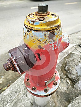 Funky painted fire hydrant on the street in urban Vietnam