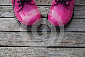 Funky Pink boots- wooden background