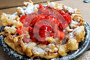 Funnel cake with strawberry topping