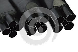 Funnel looking black rubber shrinkable cable breakout boots of various diameters, white background