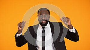 Funny african-american businessman dancing, successful deal, rich sexy man