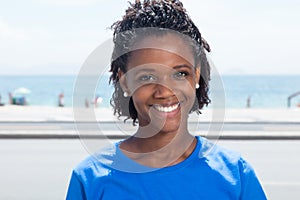 Funny african american woman in a blue shirt
