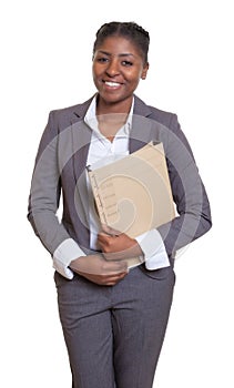Funny african businesswoman with file