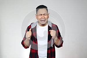 Funny Asian man crying hard, sad depression frustration hopeless expression