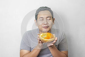 Funny Asian Man Enjoys Durian fruit