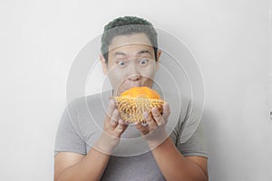 Funny Asian Man Enjoys Durian fruit