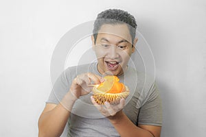 Funny Asian Man Enjoys Durian fruit