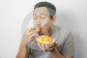 Funny Asian Man Enjoys Durian fruit