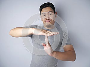 Funny Asian Man Making Time Out Gesture