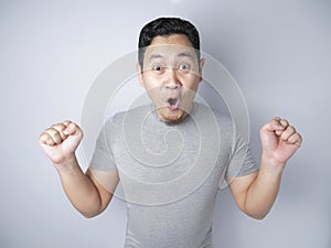 Funny Asian Man Shows Surprised Happy Expression
