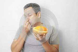 Funny Asian Man With Stinky Durian Fruit