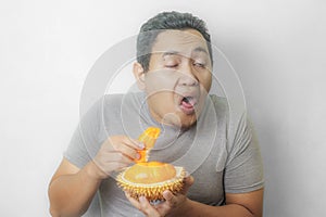 Funny Asian Man With Stinky Durian Fruit