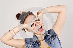 Funny attractive hipster girl clowning, happy lifestyle concept