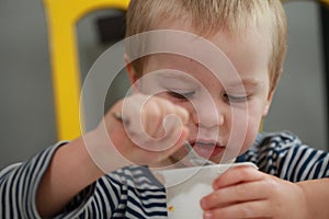 Funny babe blondes licks finger with yogurt