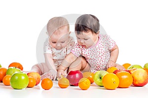 Funny babies eating healthy food fruits
