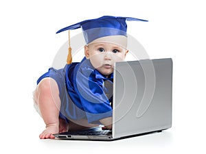 Funny baby in academician clothes at laptop