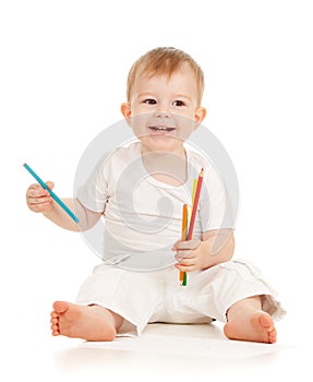 Funny baby boy drawing with color pencils