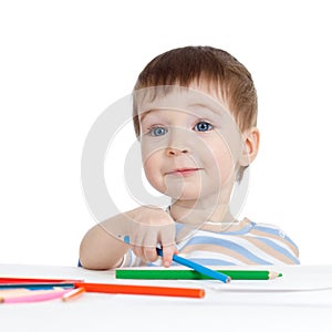 Funny baby boy drawing with color pencils