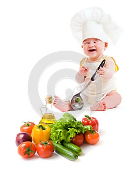 Funny baby boy preparing healthy food