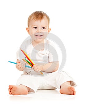 Funny baby boy sitting with color pencils