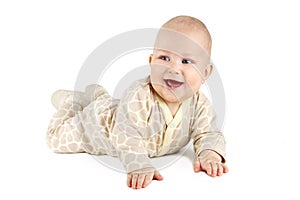 Funny baby boy smiling and showing his first teeth.