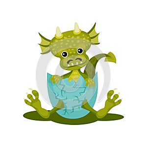 Funny baby dragon in blue broken egg shell. Green mythical monster with cute muzzle. Flat vector icon