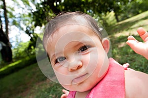 Funny baby face with big cheeks