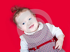 Funny baby girl in red Christmas dress