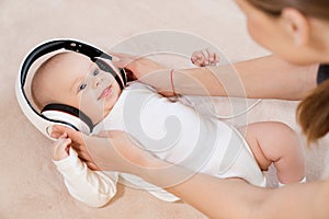 Funny baby little boy in headphones