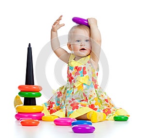 Funny baby playing with color developmental toy photo