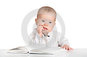 Funny baby reading a book isolated on white background