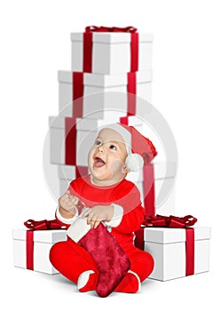Funny baby Santa Claus with Christmas gifts on white