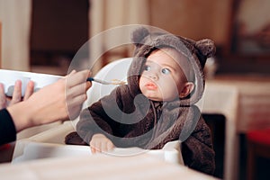 Funny Baby Sitting in Highchair Refusing to Eat