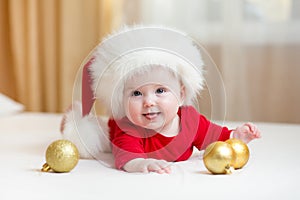 Funny baby weared in Santa hat photo