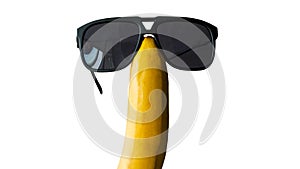 Funny banana in glasses isolated on white,banana fruit in sunglasses