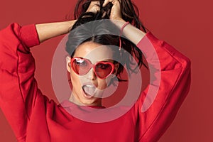 Funny beautiful girl in red sunglasses