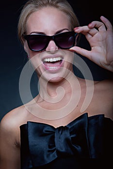 Funny blond wearing sun glasses