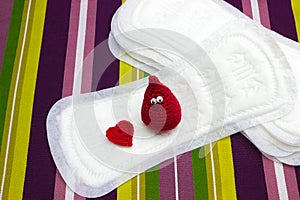 Funny blood crochet drop and heart with menstruation sanitary soft pads, napkin. Woman hygiene protection. Woman critical days, gy