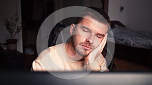 Funny bored at home office worker falling asleep at office desk, sleepy male student employee sleeping at workplace near